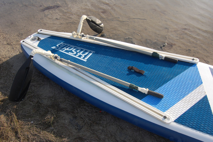 A paddle board with a supski paddle system on it.