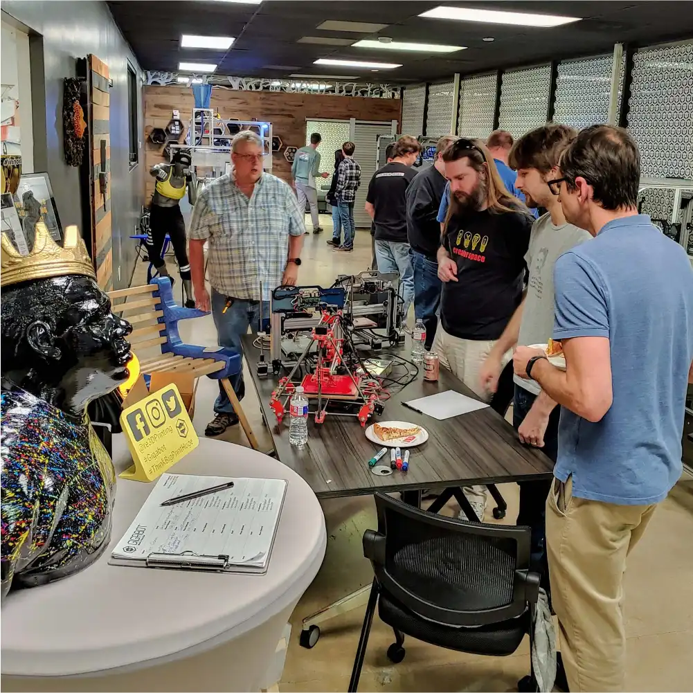People talking in a 3D printing meetup